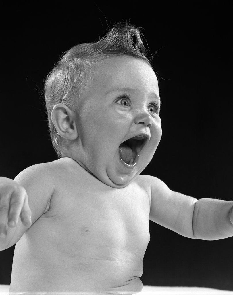 Detail of 1950s happy baby head laughing with mouth wide open by Anonymous