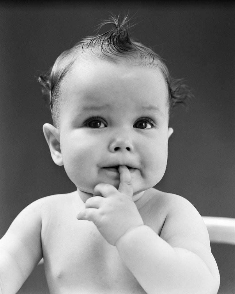 Detail of 1940s thoughtful baby with finger in mouth by Anonymous