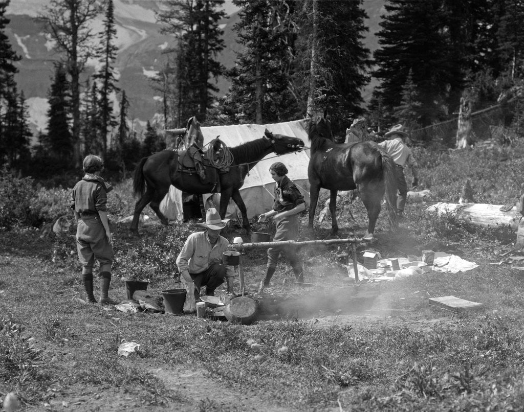 Detail of 1920s group men women at rough campsite cooking fire horses campfire wilderness adventure cowboy tent canada assiniboine by Anonymous