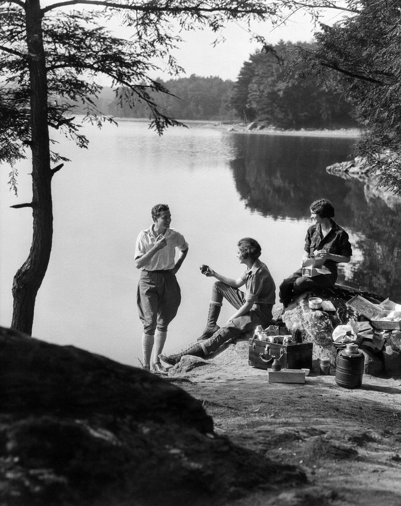 Detail of 1920s 1930s 3 people picnicking by onata lake man wearing jodhpurs standing two seated women berkshires ma usa by Anonymous