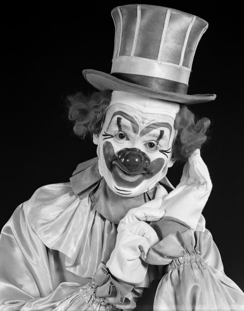Detail of 1950s portrait of clown wearing top hat smiling looking at camera by Anonymous