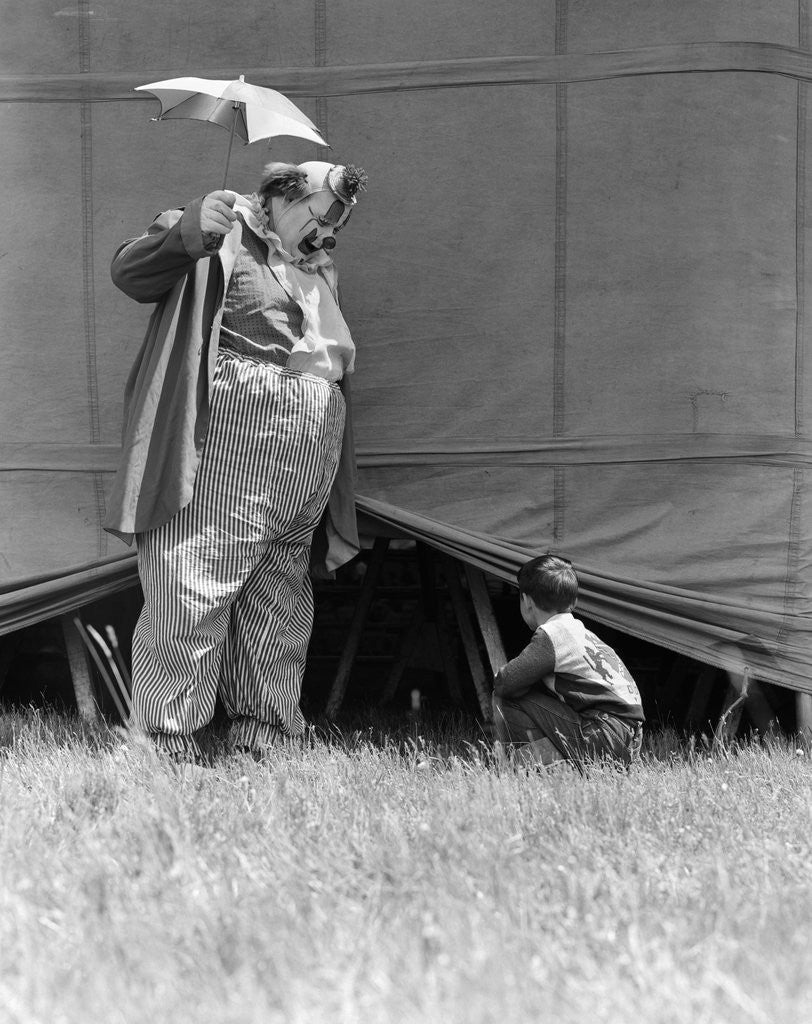 Detail of 1930s man clown catching little boy peeking under circus big top tent by Anonymous