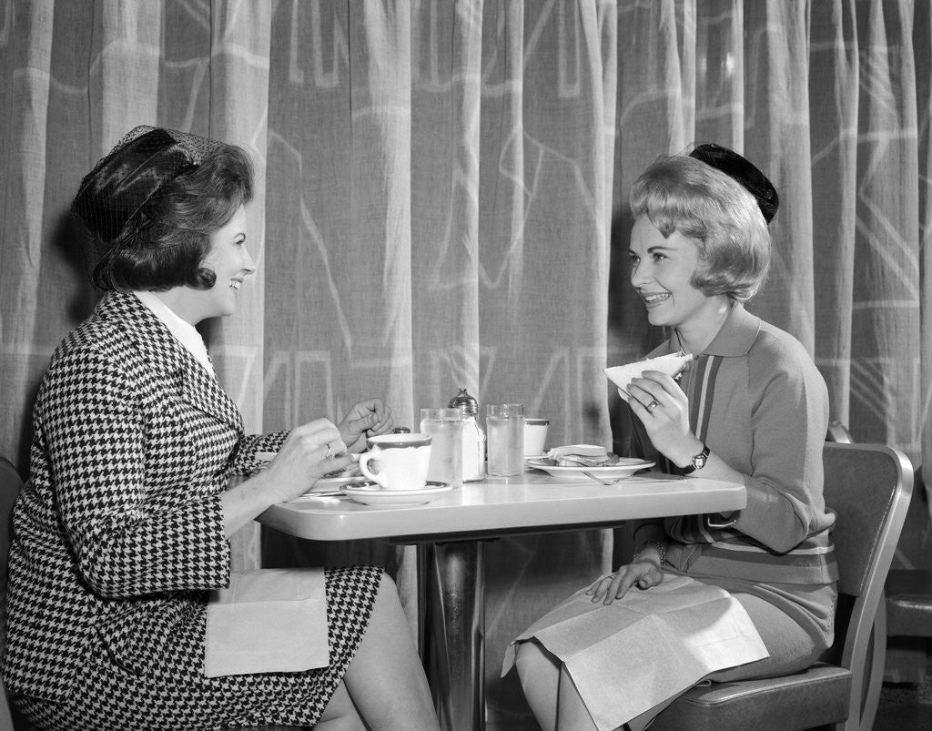 Detail of 1960s two women having lunch in coffee shop restaurant by Anonymous