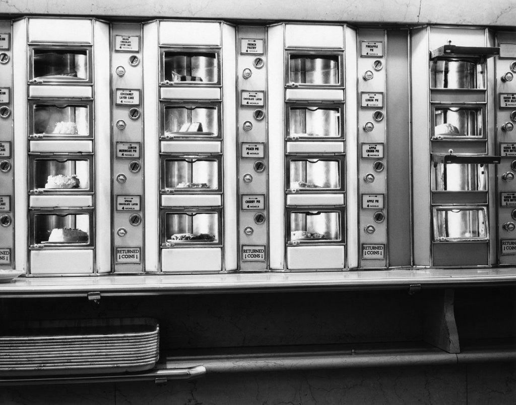 Detail of 1920s 1930s 1940s 1950s series automat cafeteria vending machine windows containing cake and pie desserts by Corbis