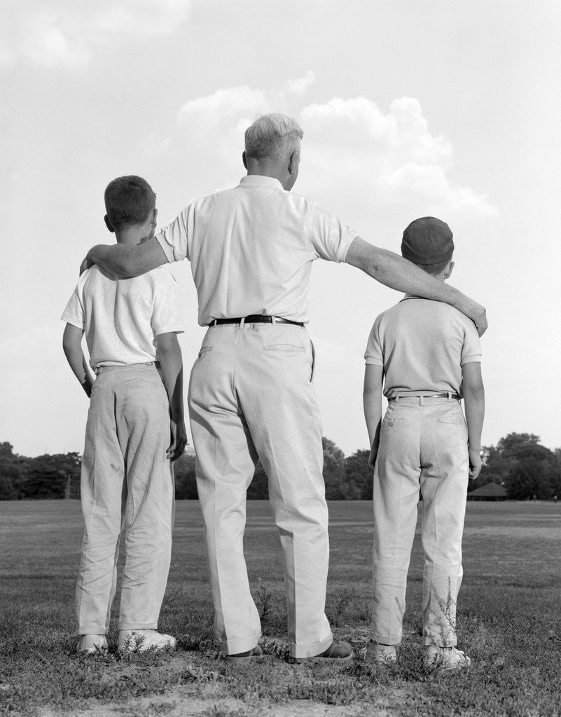 Detail of 1960s back view grandfather with two grandsons boys by Anonymous