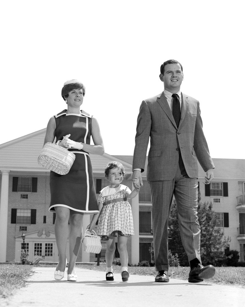 Detail of 1960s 1970s family taking a walk sidewalk by Anonymous