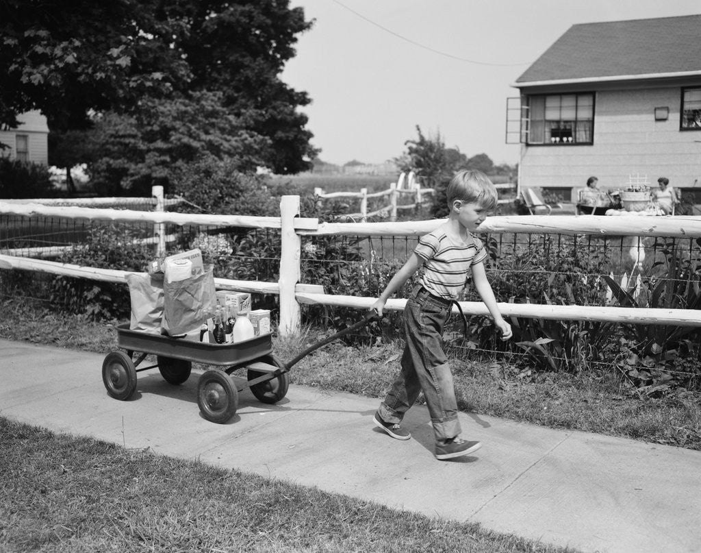 Detail of 1950s boy pulling groceries in wagon by Anonymous