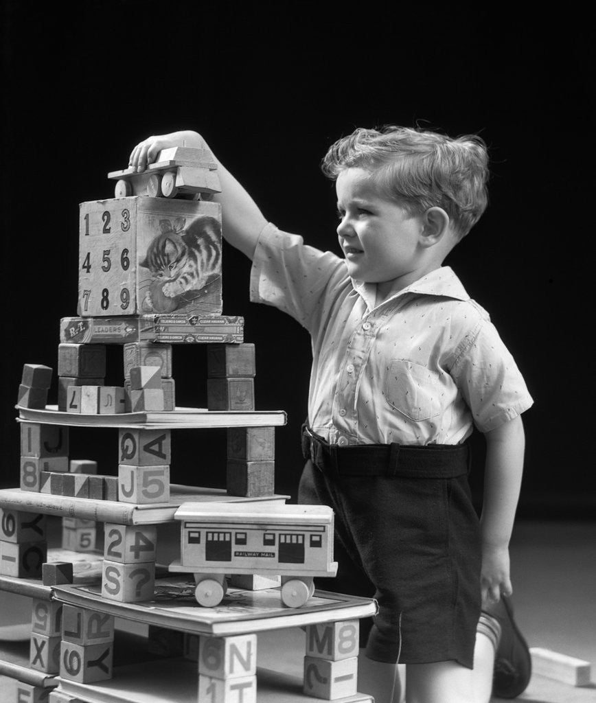 Detail of 1930s boy playing with toys and building blocks by Anonymous