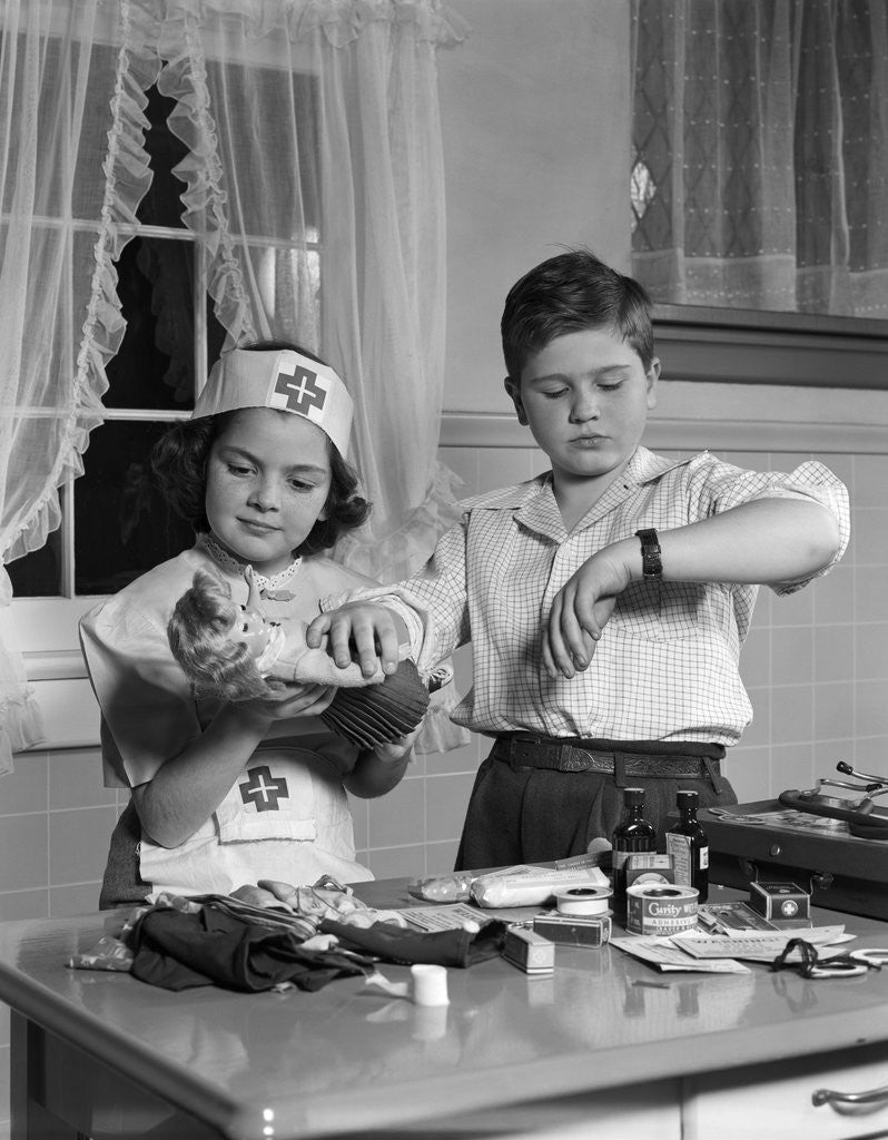 Detail of 1950s two children playing doctor nurse by Corbis