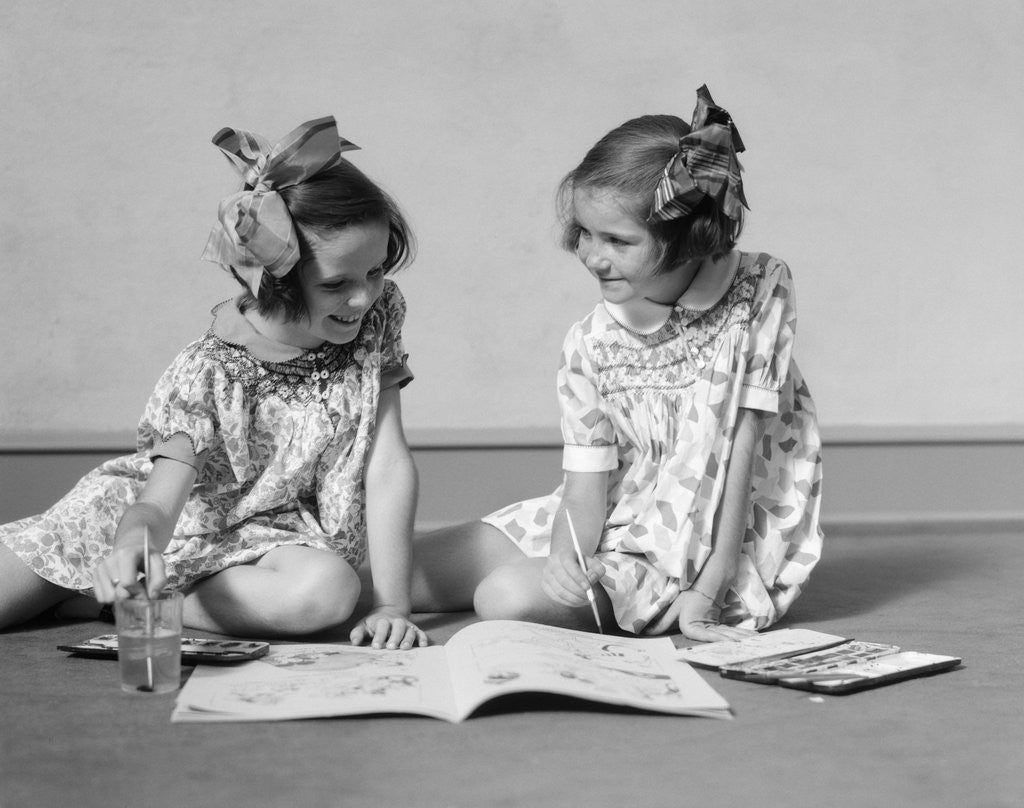 Detail of 1930s two girls painting in book with watercolors by Anonymous
