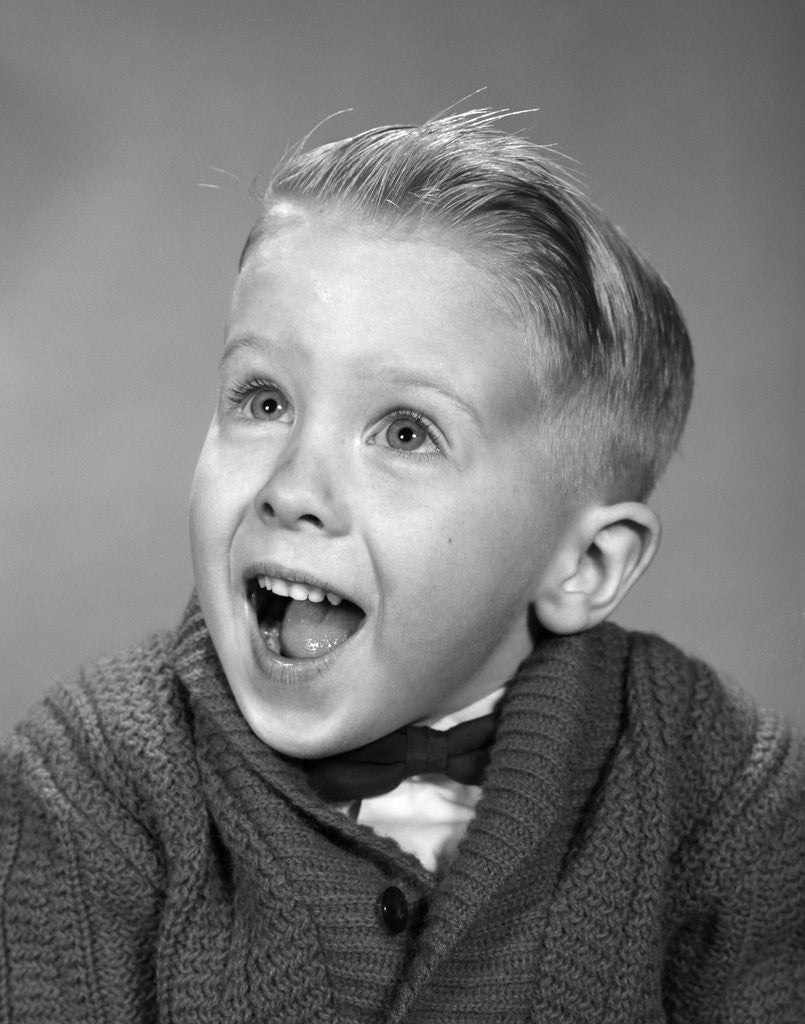 Detail of 1960s young blond boy with happy surprised facial expression by Anonymous