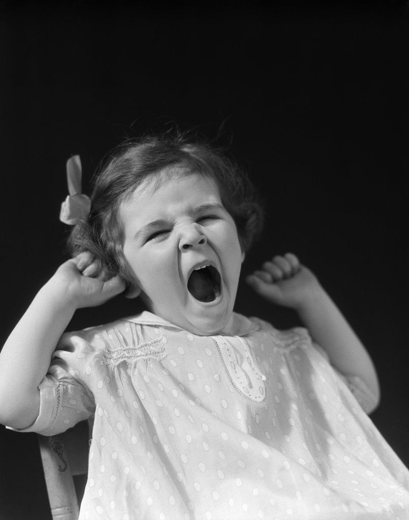 Detail of 1930s little girl yawning by Corbis