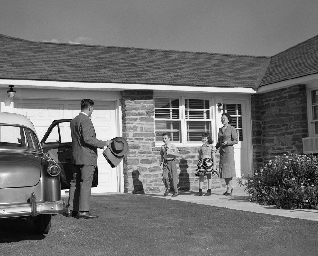 Detail of 1950s family greeting father in driveway by Anonymous