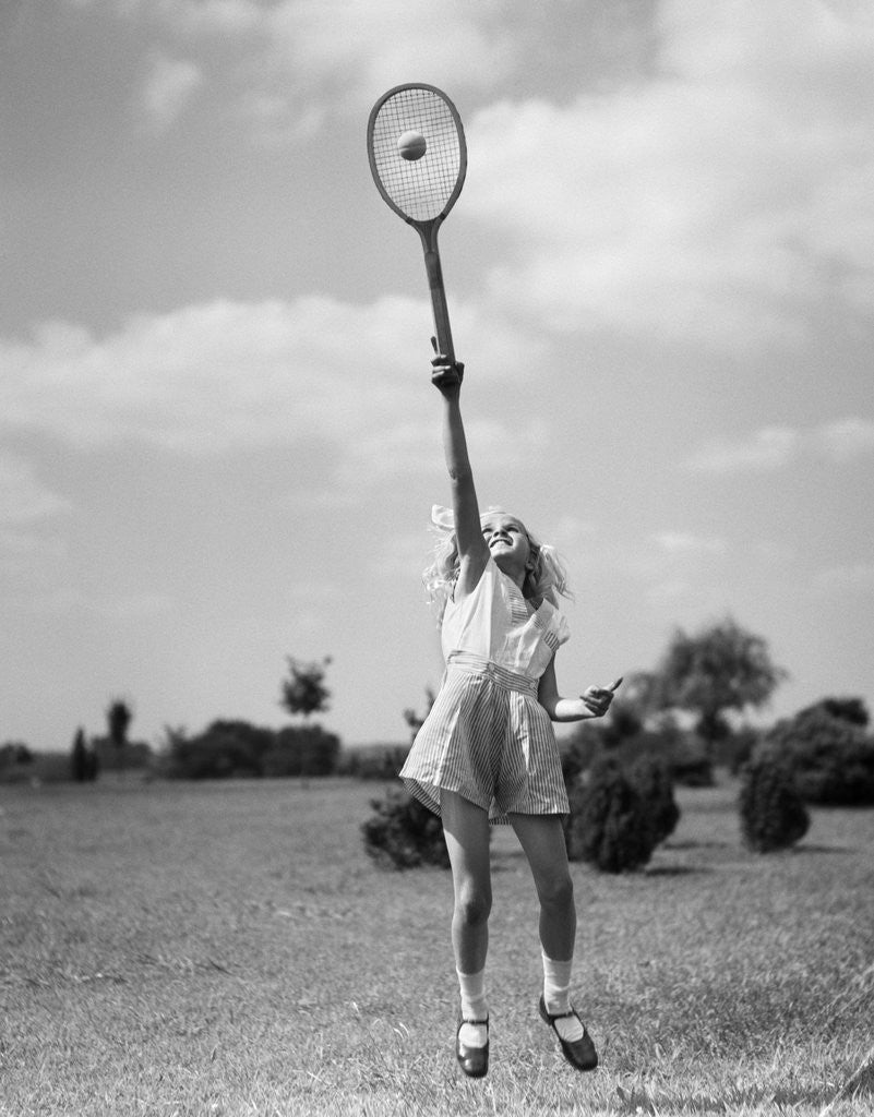 Detail of 1930s girl playing tennis jumping to hit ball overhead by Anonymous