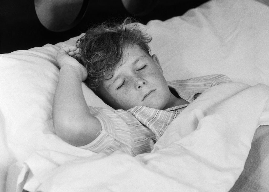 Detail of 1940s 1950s boy sleeping in bed by Corbis