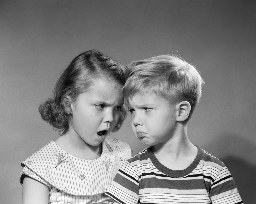 Detail of 1950s boy girl head to head angry facial expressions argument fight by Corbis