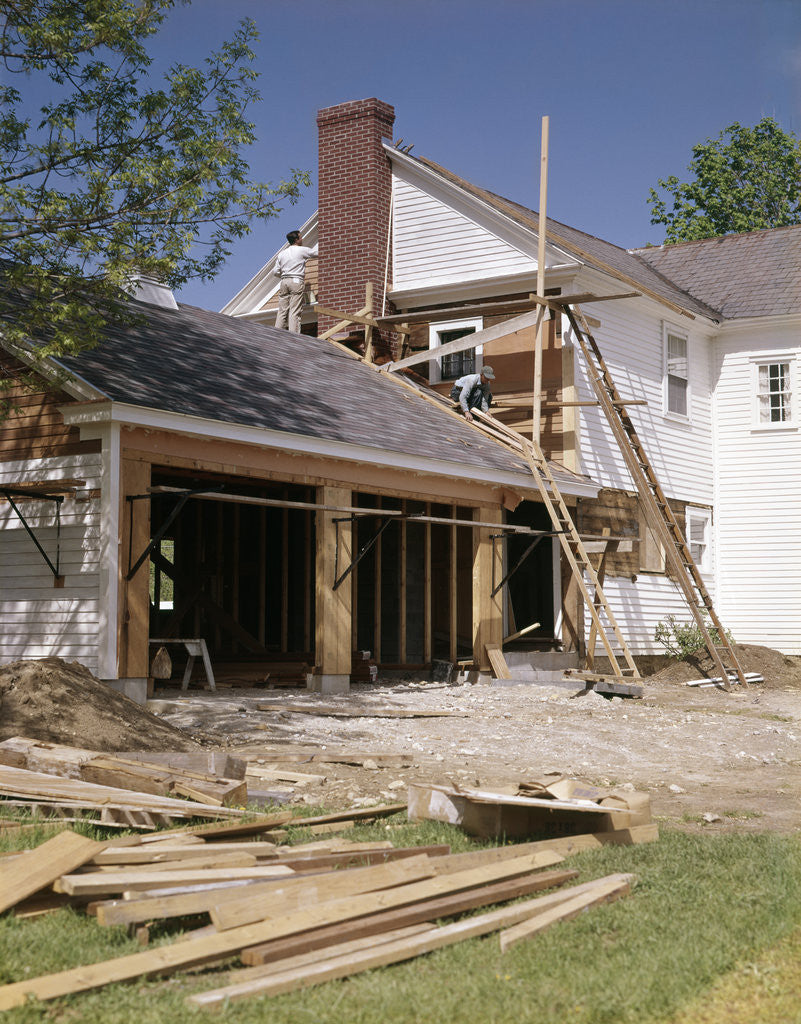 Detail of 1960s 1970s workers building two car garage addition onto suburban home by Anonymous