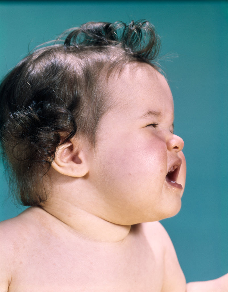 Detail of 1960s profile head shoulders crying screaming baby by Anonymous