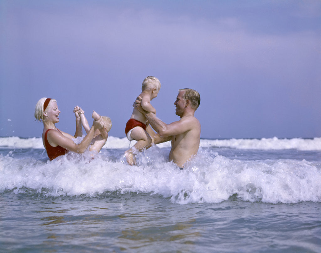 Detail of 1970s family playing in ocean surf by Anonymous