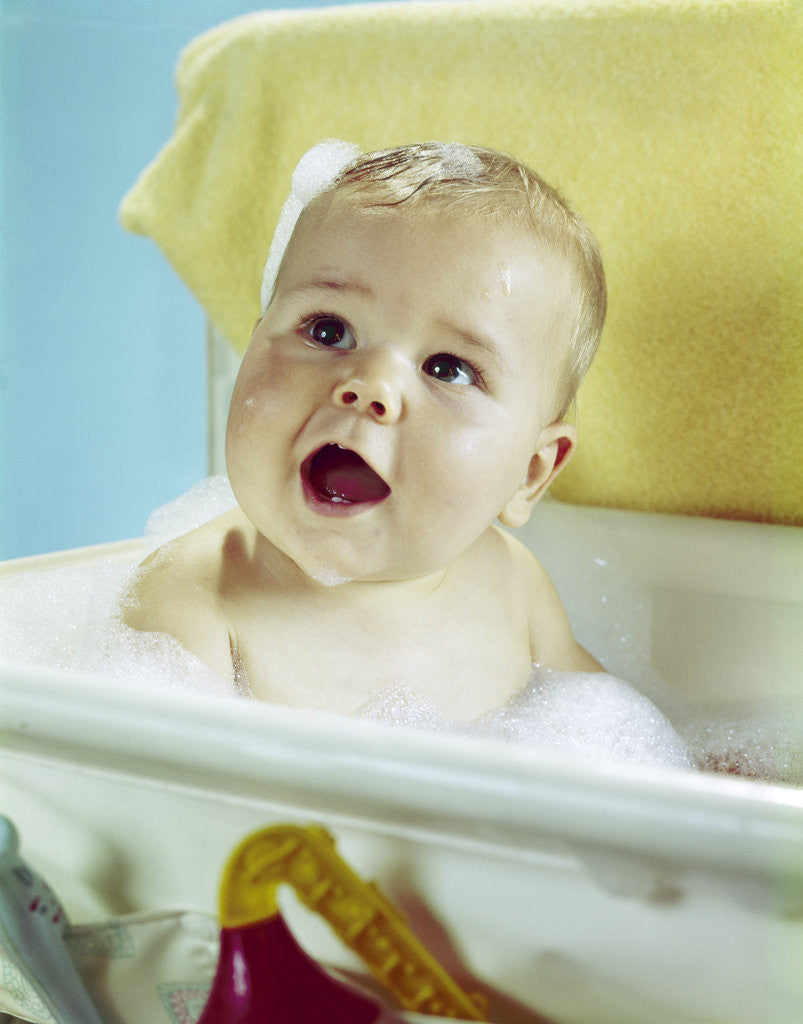 Detail of 1960s happy baby taking bath by Corbis