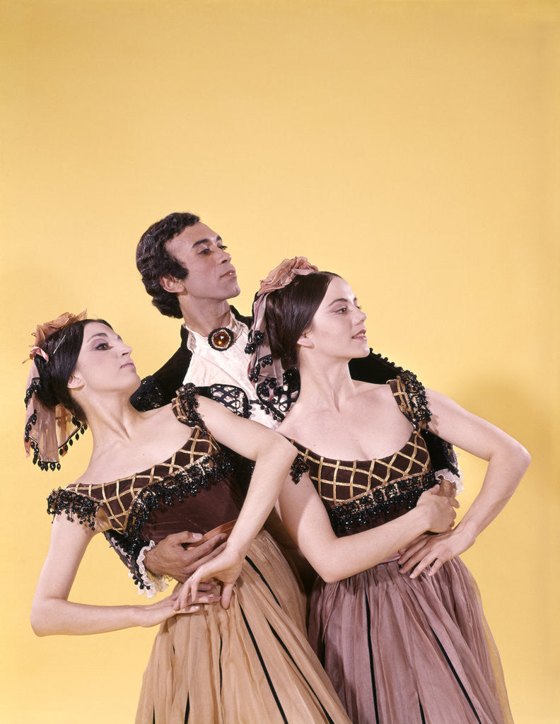 Detail of 1970s spanish ballet dancer man two women costumes posed together by Anonymous