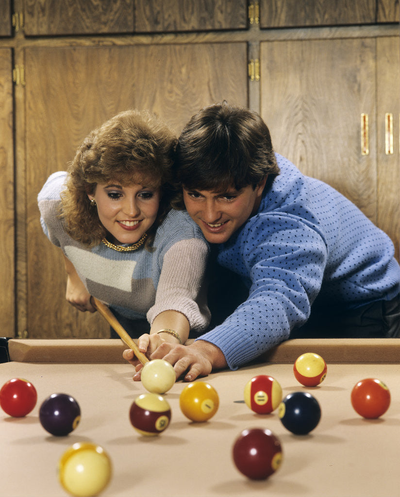 Detail of 1980s teen couple playing pool by Anonymous