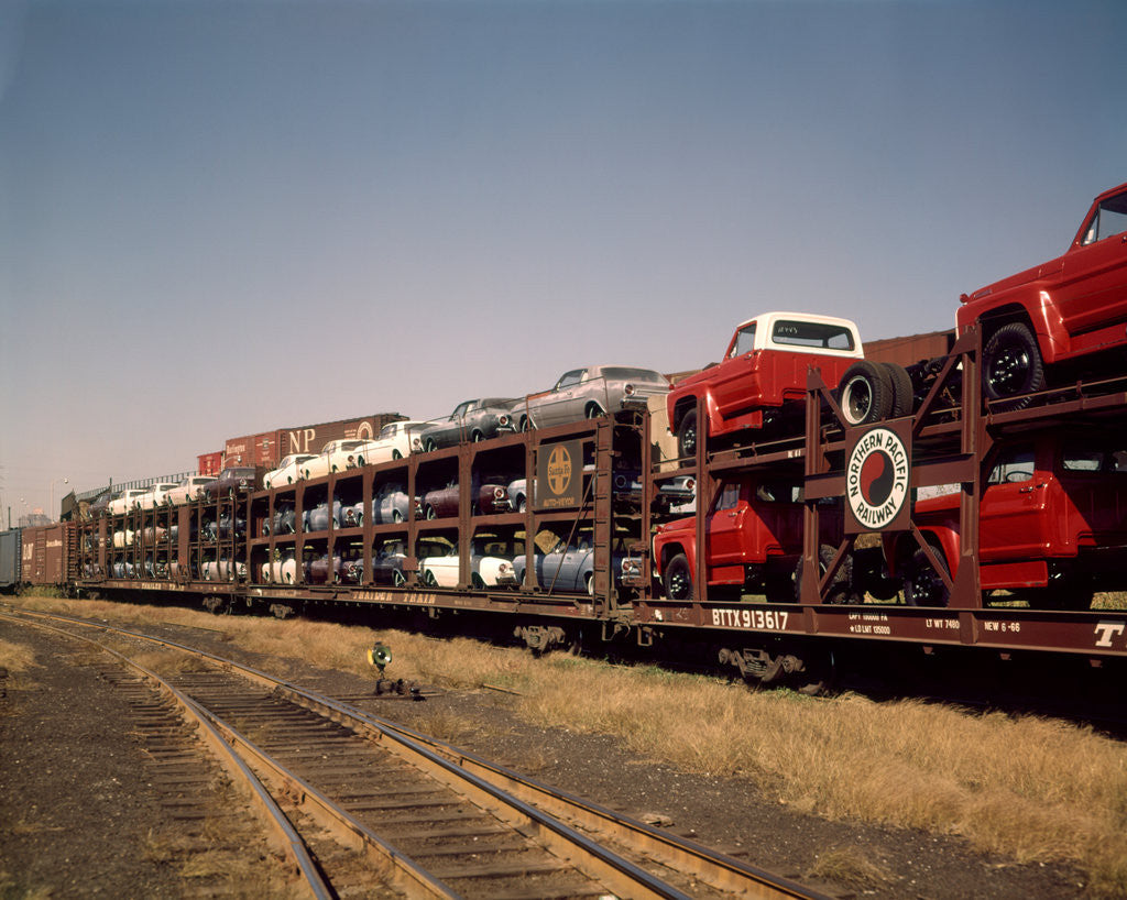 Detail of 1960 1960s new cars & trucks transported on northern pacific railroad railway train transportation by Corbis