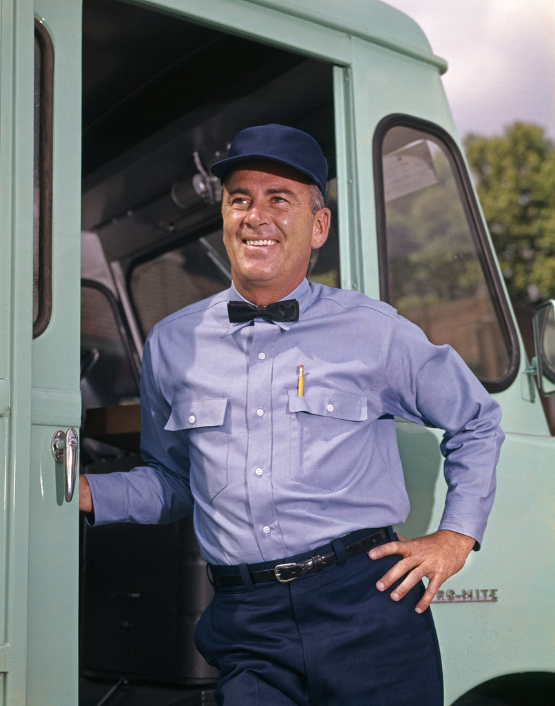1950s 1960s smiling delivery man wearing uniform work clothes hat