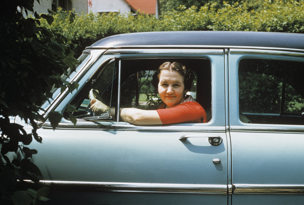 Detail of 1950s woman driver looking out of car window by Anonymous