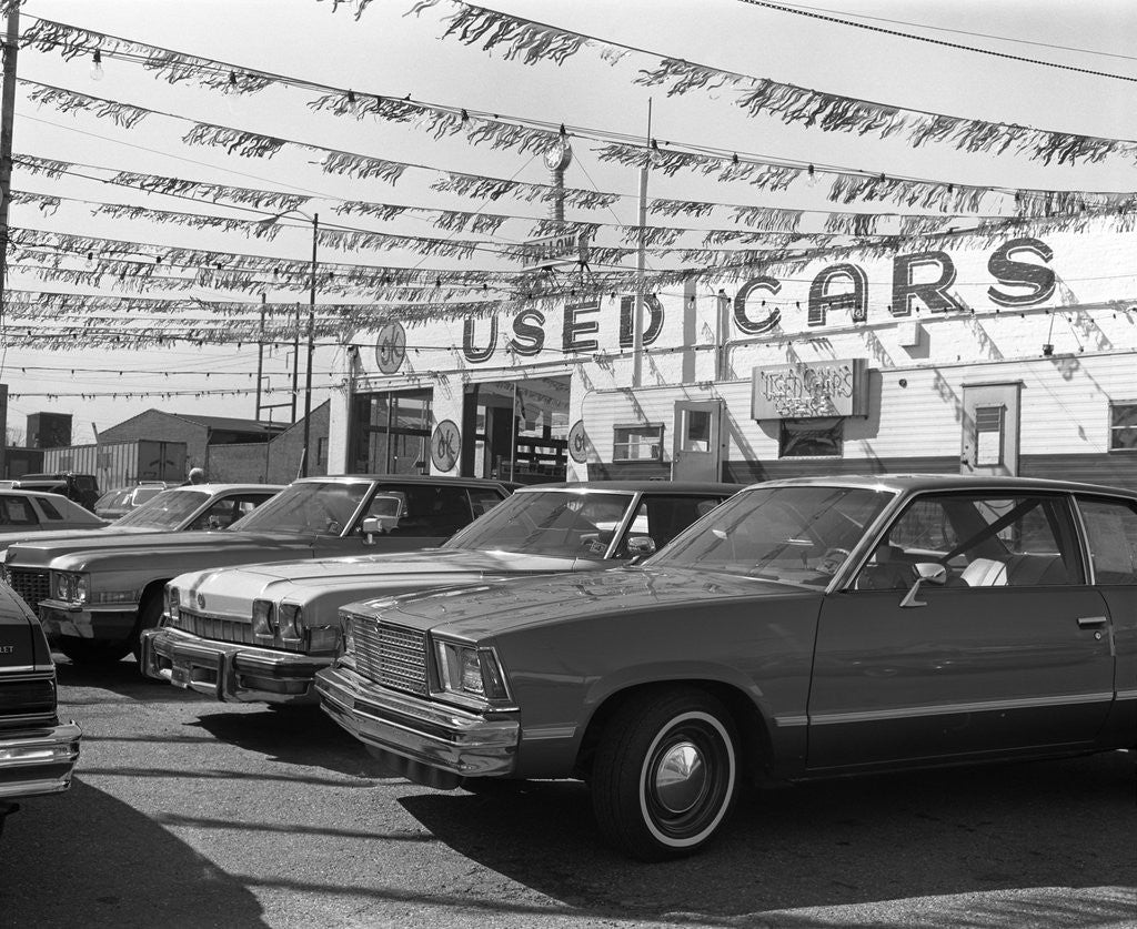 Detail of 1970s cars for sale in outdoor ok used car lot by Anonymous