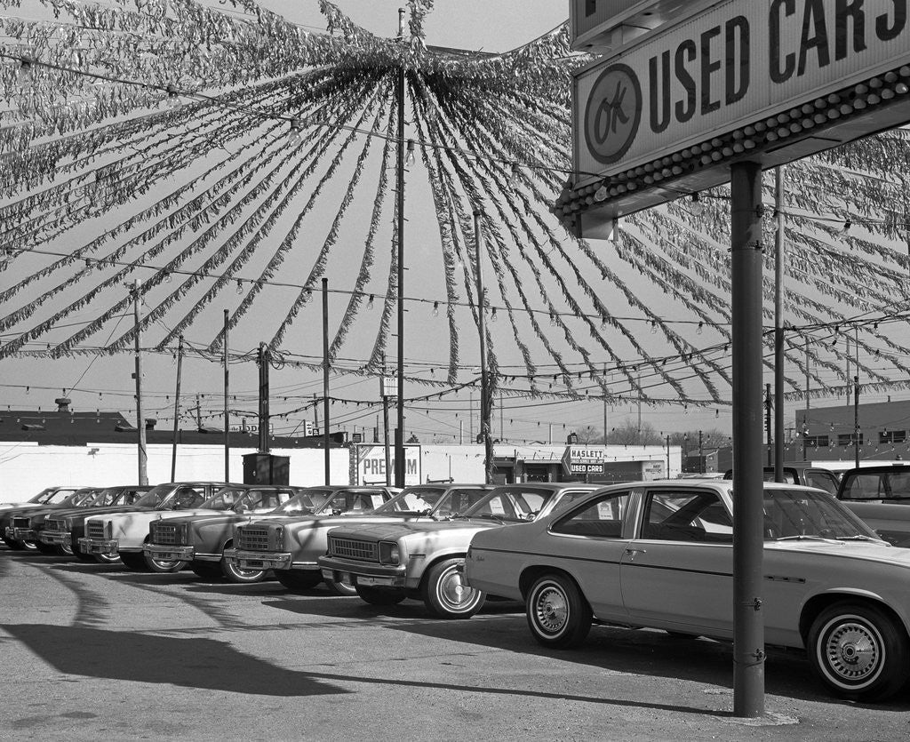 Detail of 1970s cars for sale in outdoor ok used car lot by Anonymous