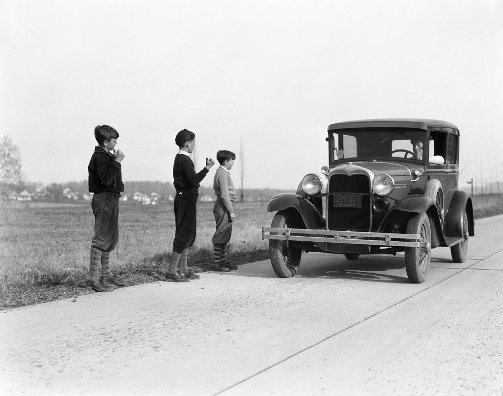 Detail of 1930s 1920s man driving ford model a car 3 boys hitchhiking by Anonymous