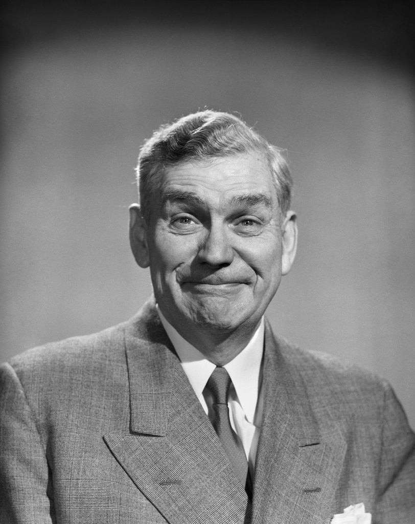 Detail of 1950s mature middle aged man smiling business suit tie happy amused funny face expression by Anonymous