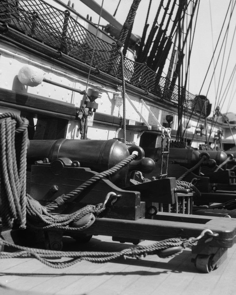 Detail of 1930s row of cannon breeches on gun deck of sailing naval ship of war by Anonymous