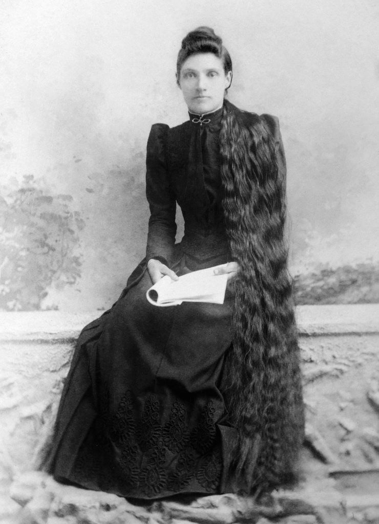 Detail of Young woman with long hair portrait, ca. 1900. by Anonymous