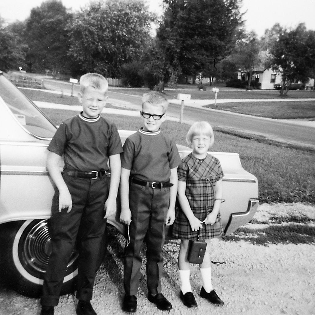 Detail of A lineup of kids by the family car. 1965. by Anonymous