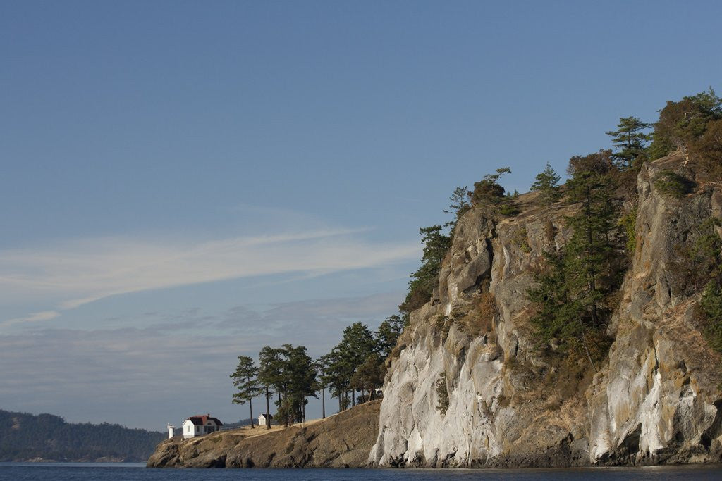 Detail of North America, United States, Washington, lighthouse and cliff in San Juan Islands, by Corbis