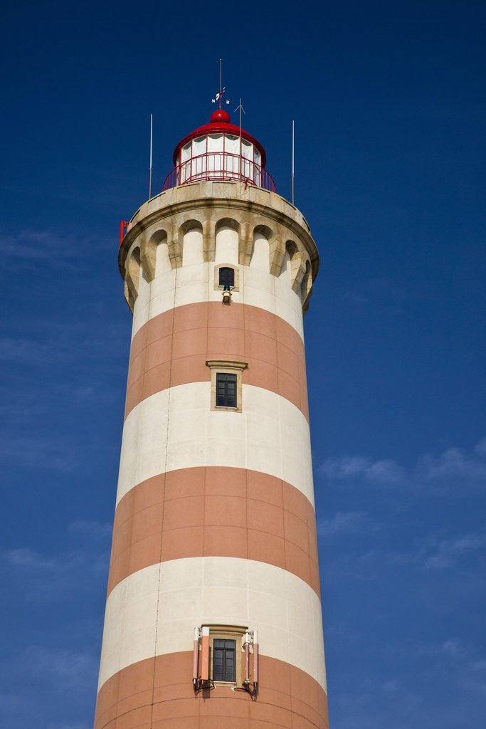 Detail of Barra lighthouse located on the ocean coast in the fishing village of Costa Nova by Anonymous