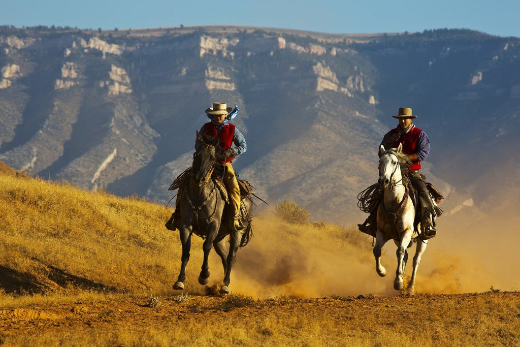 Detail of Cowgirl and cowboy riding together by Anonymous