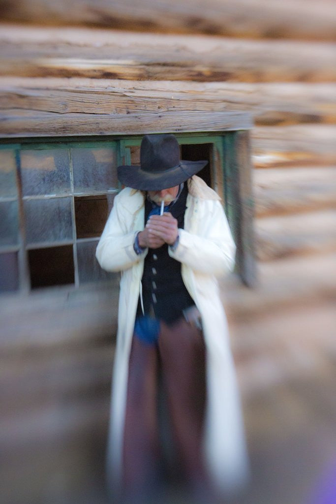 Detail of Cowboy lighting a cigarette by Anonymous