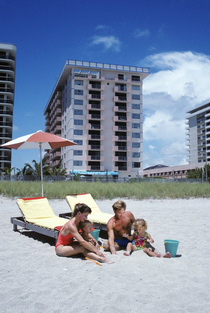 Detail of 1990s Young Family On Beach Playing In The Sand by Anonymous