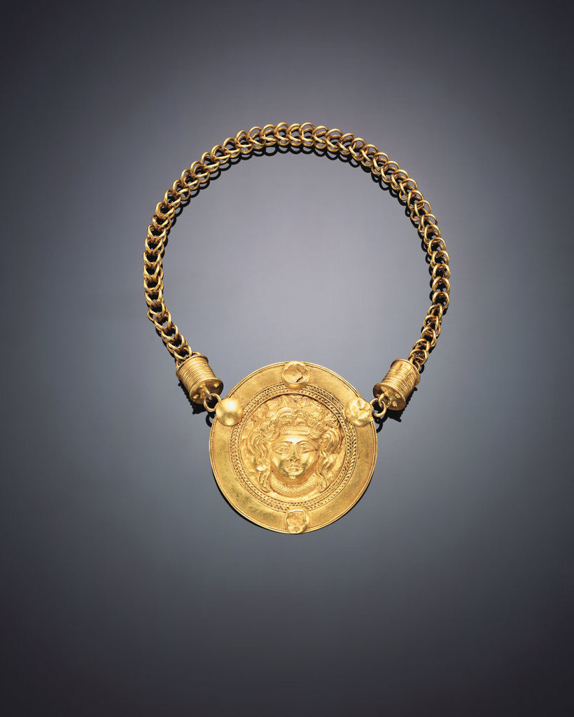 Detail of A Roman gold necklace, with a large central medallion featuring a repousse facing head of Medusa by Corbis
