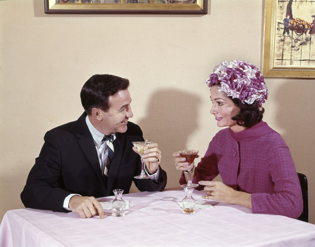 Detail of 1960s Couple Drinking Cocktails At Table Husband Wife Indoor by Anonymous