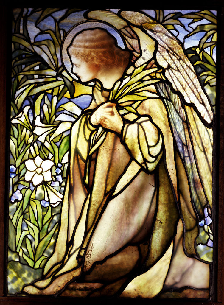 Detail of Tiffany Studios stained glass window of a kneeling angel by Corbis