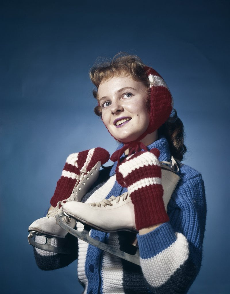 Detail of 1960s Smiling Woman Wearing Red Mittens Ear Muff Blue Sweater Holding Ice Skates by Anonymous