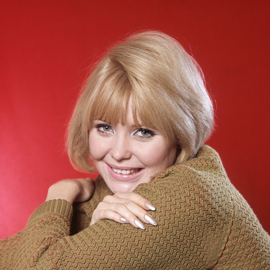 Detail of 1960s Portrait Woman Blond Hair Gold Sweater Looking At Camera by Corbis