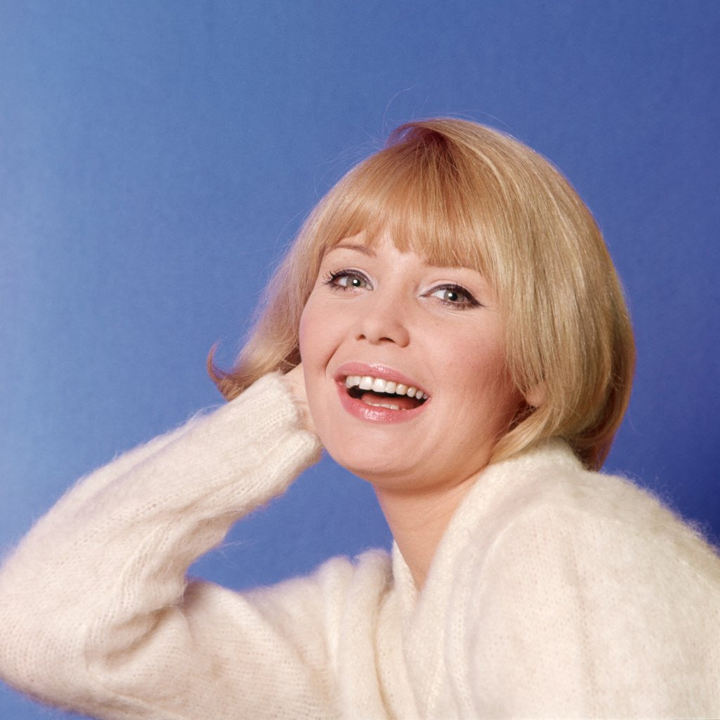 Detail of 1970s Portrait Of Woman With Blond Hair And White Sweater by Anonymous