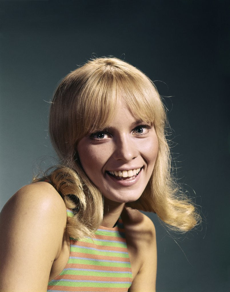 Detail of 1960s Portrait Of Young Blond Woman Smiling Wearing Striped Sleeveless Top by Anonymous