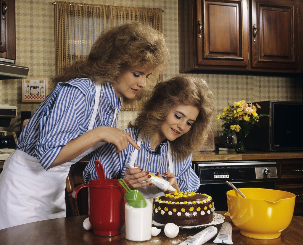 Detail of 1970s Mother Daughter Dressed Alike Decorating Cake by Anonymous