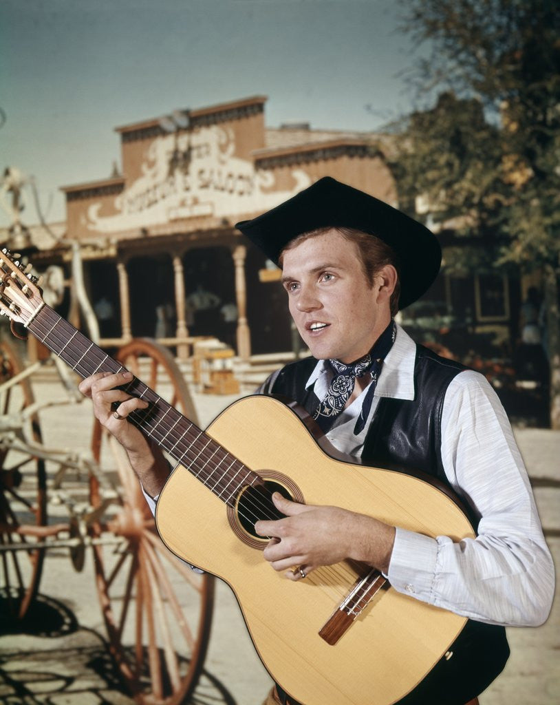 Detail of 1960s Man Singing Cowboy Strumming Playing Acoustic Guitar by Anonymous